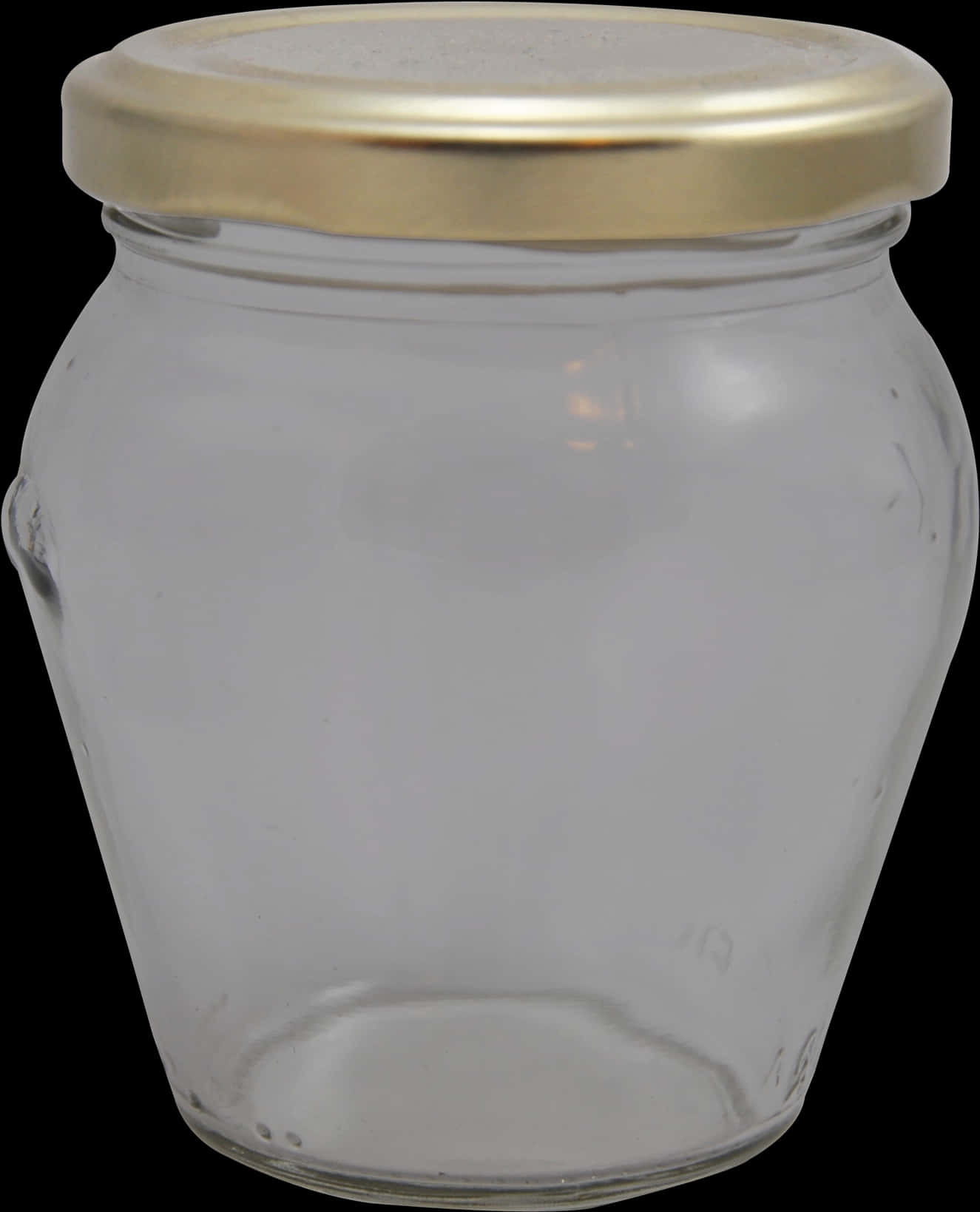 A Glass Jar With A Gold Lid
