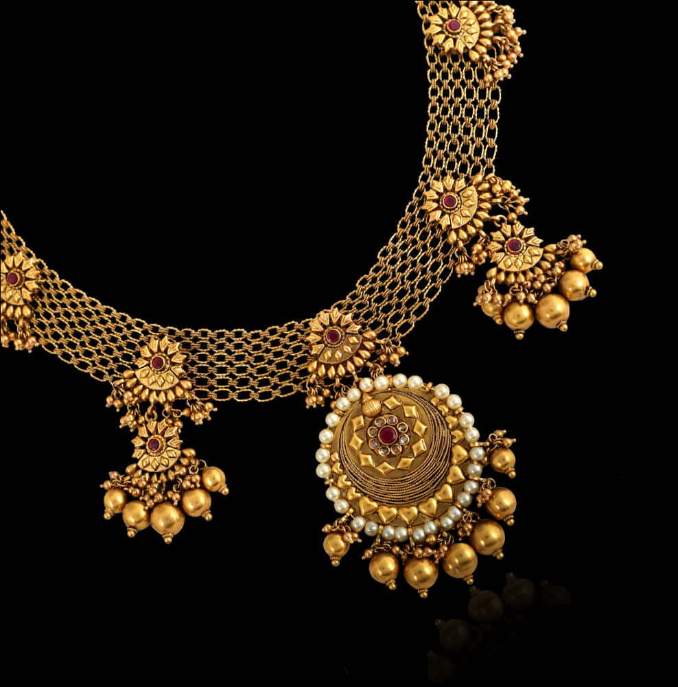 A Gold Necklace With Red And White Stones