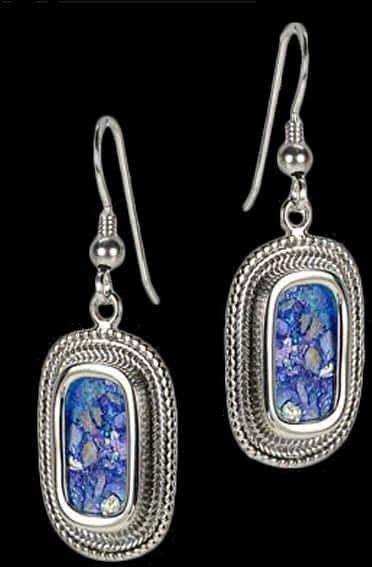 A Pair Of Earrings With Blue Stones