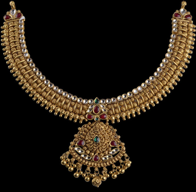 A Gold Necklace With Red And Green Stones