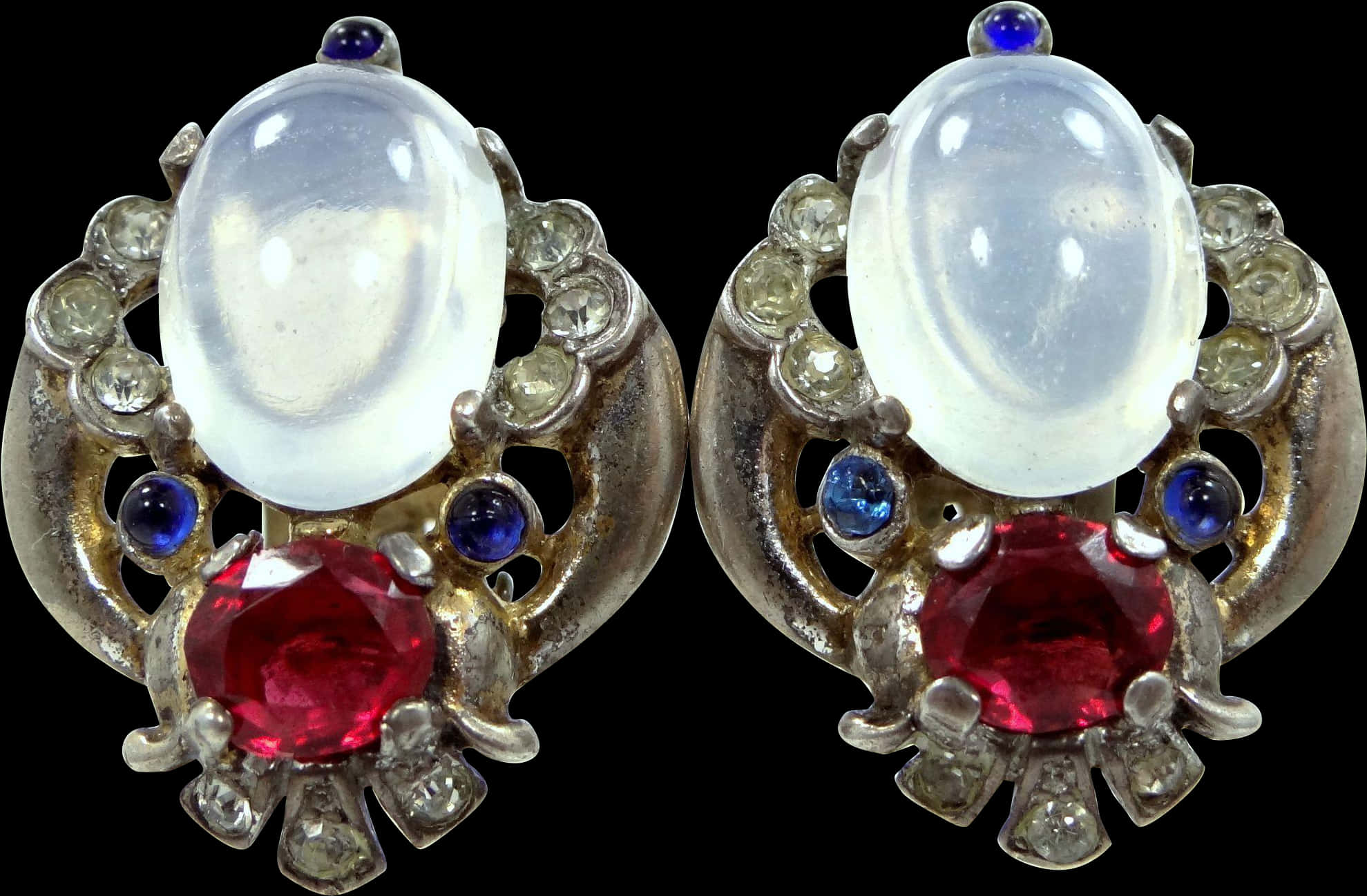 A Pair Of Earrings With Gems
