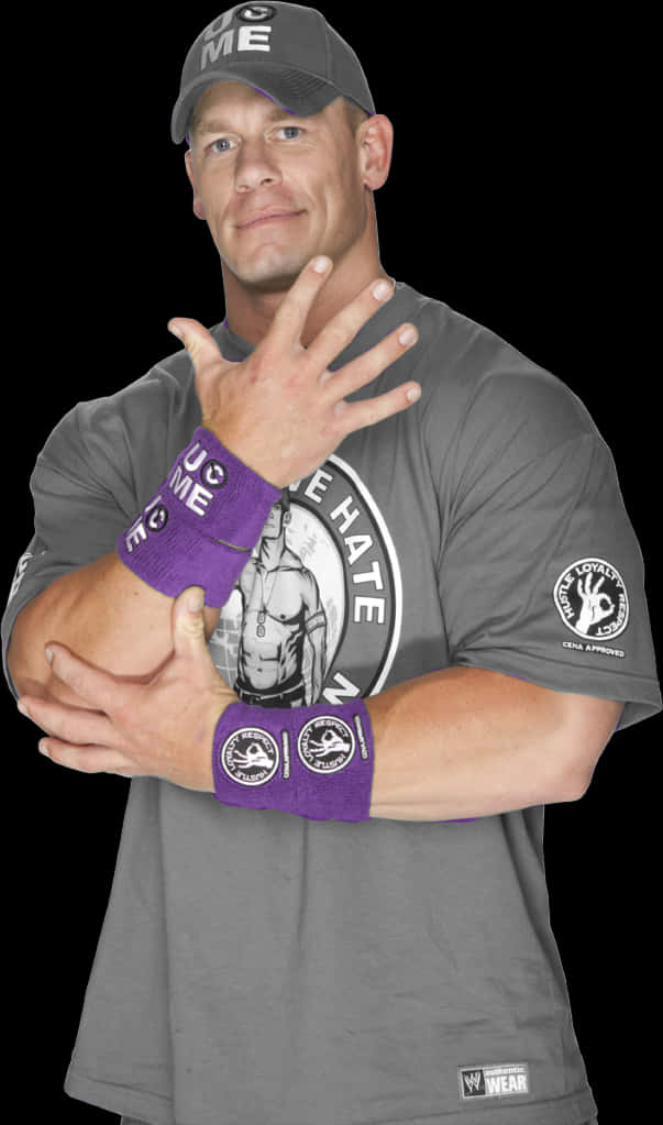 A Man Wearing A Grey Shirt And Purple Wrist Bands