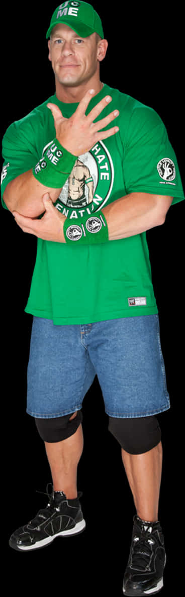 A Man Wearing A Green Shirt And Blue Jeans