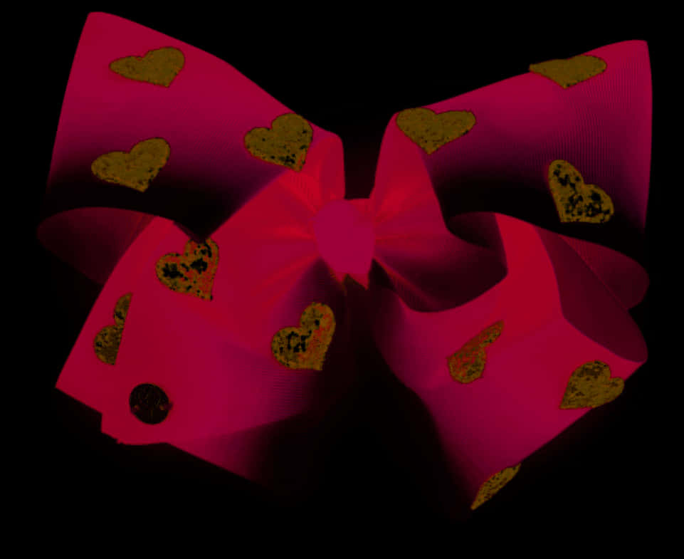 A Pink Bow With Gold Hearts On It