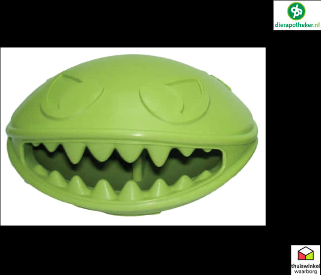 A Green Plastic Toy With Teeth