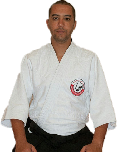 A Man In A White Karate Uniform