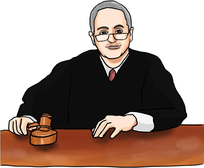 A Man Sitting At A Table With A Gavel