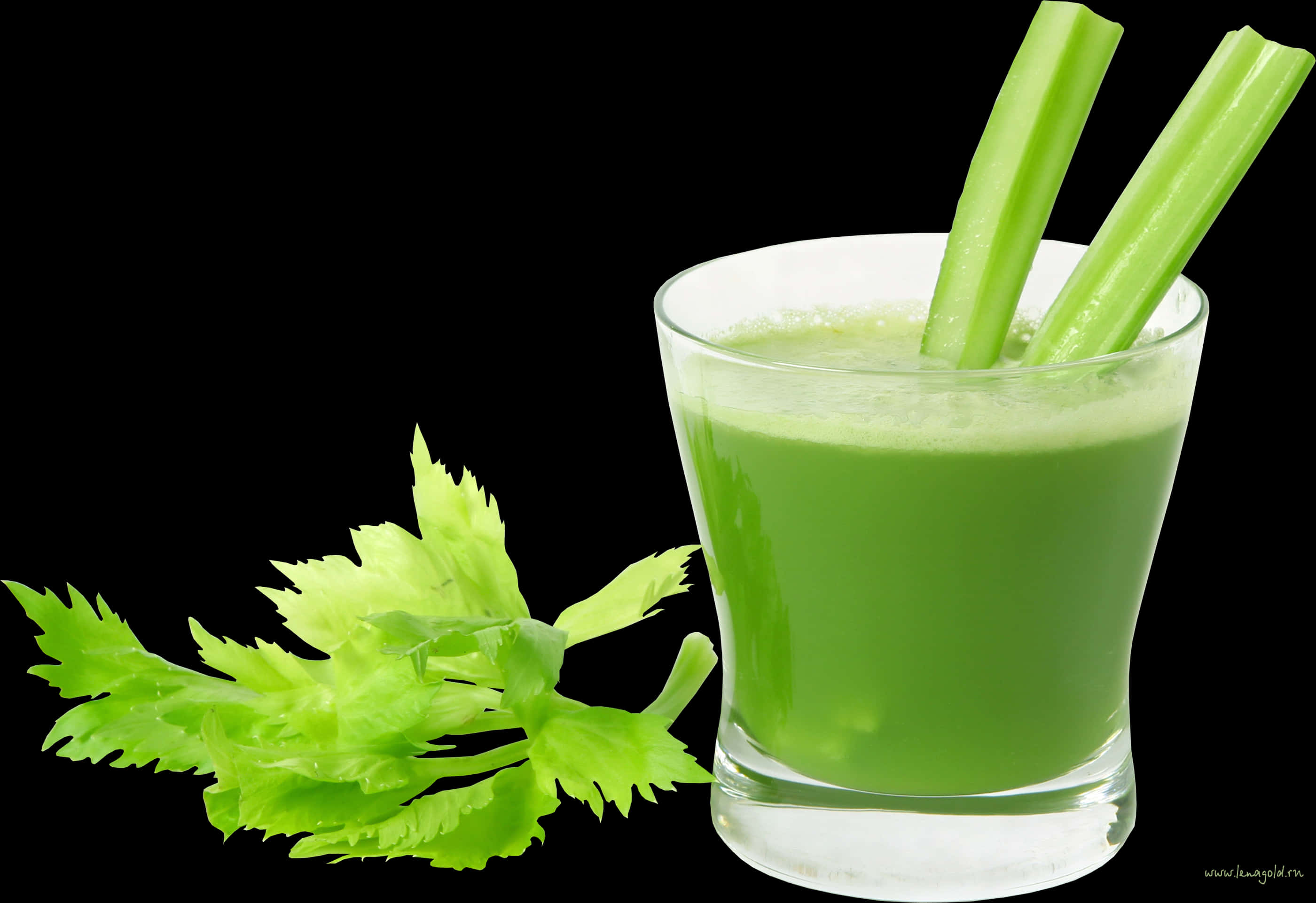 A Glass Of Celery Juice And Celery Leaves