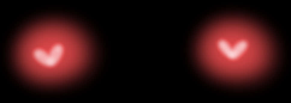 A Close-up Of Two Red Lights