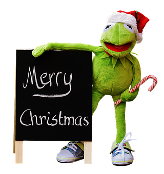 A Green Frog Doll With A Candy Cane And A Blackboard