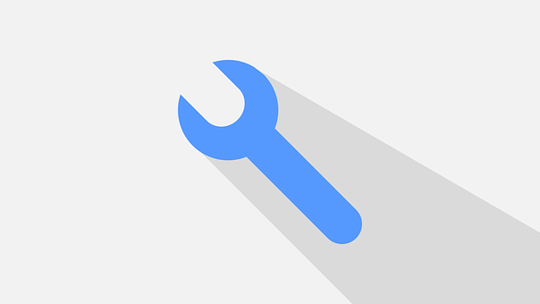 A Blue Wrench On A White Surface