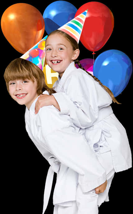 A Boy And Girl Wearing Karate Uniforms And Birthday Hats