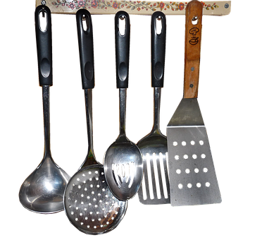A Group Of Kitchen Utensils On A Rack