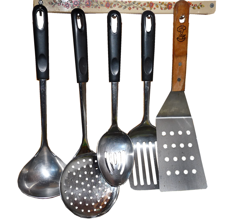 A Group Of Kitchen Utensils On A Rack