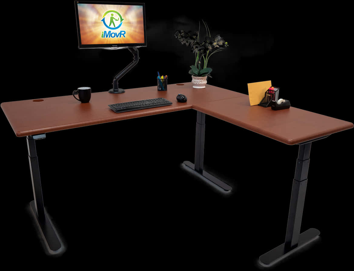 A Desk With A Computer Monitor And A Plant On It