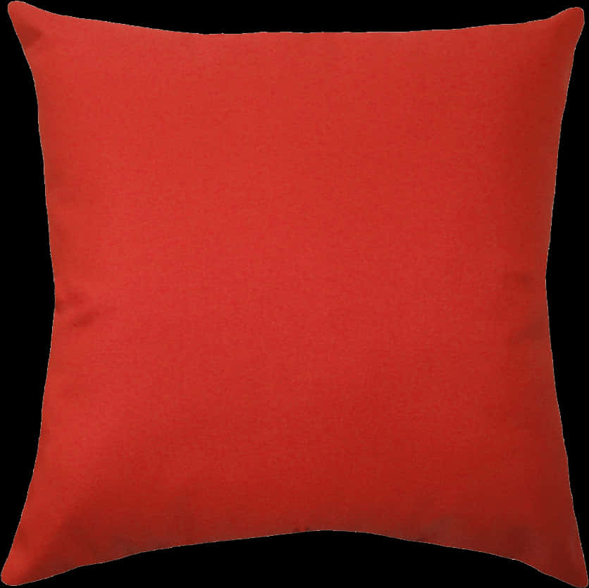 A Red Pillow On A Black Background