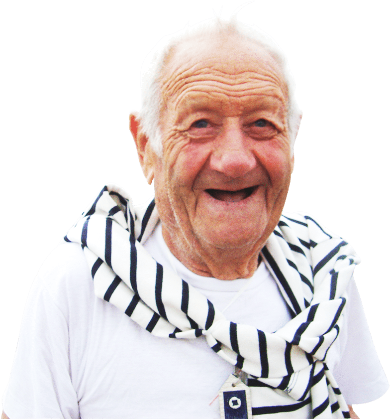 An Old Man Smiling With A Striped Scarf Around His Neck