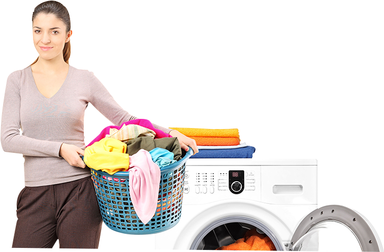 A Woman Holding A Laundry Basket Next To A Washing Machine