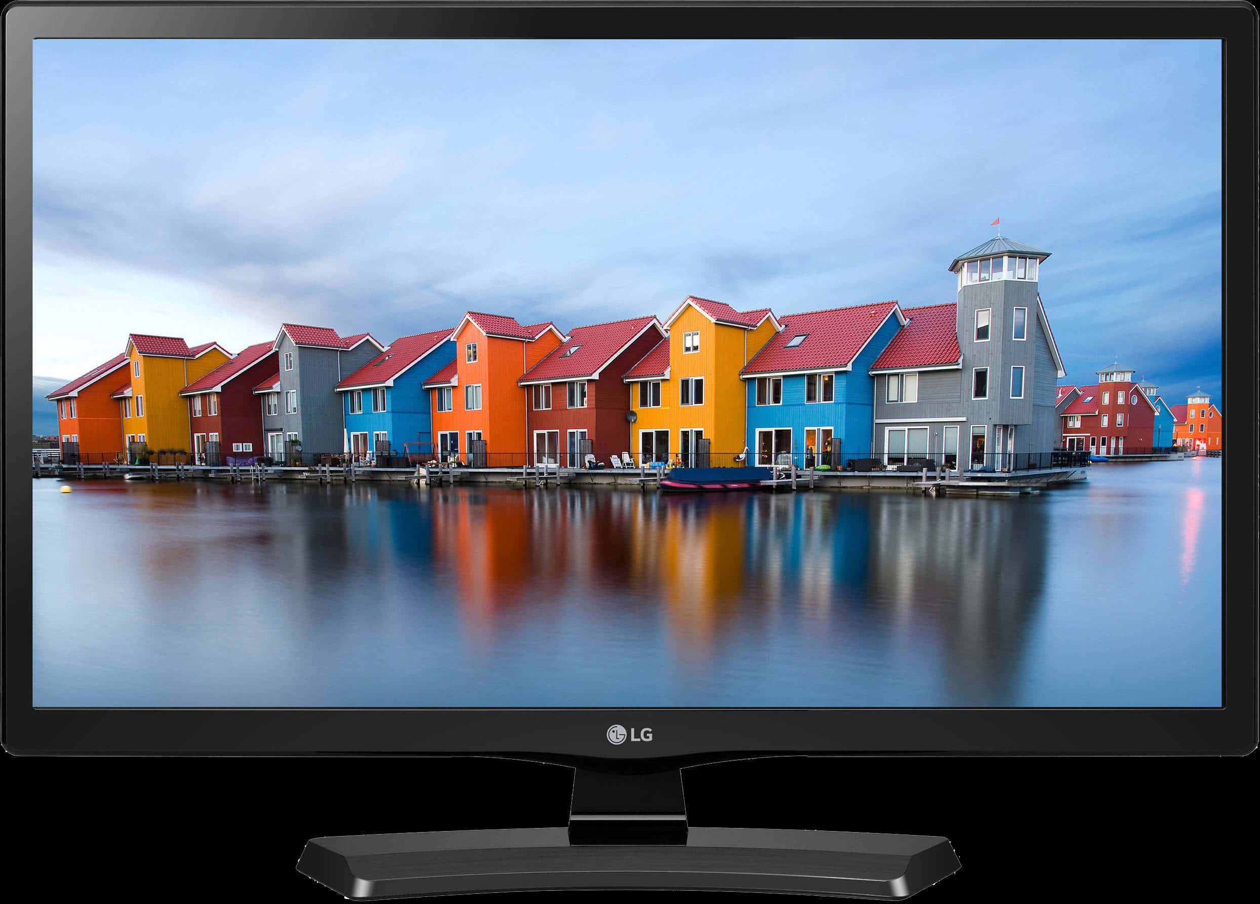 A Computer Monitor With A Row Of Colorful Houses On The Water