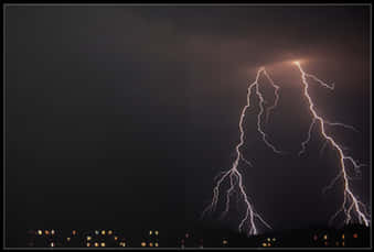 Lightning Striking Lightening In The Night Sky