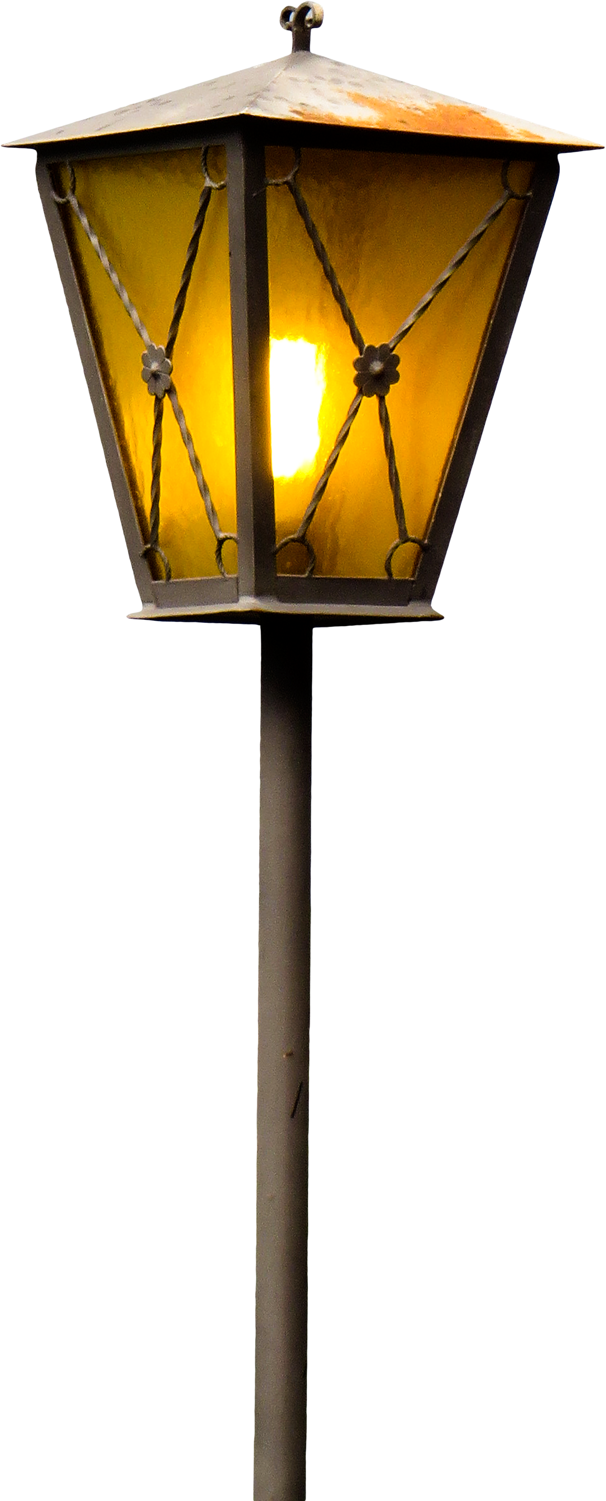 A Lamp Post With A Yellow Light