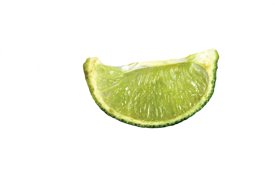 A Lime Wedge On A Black Background