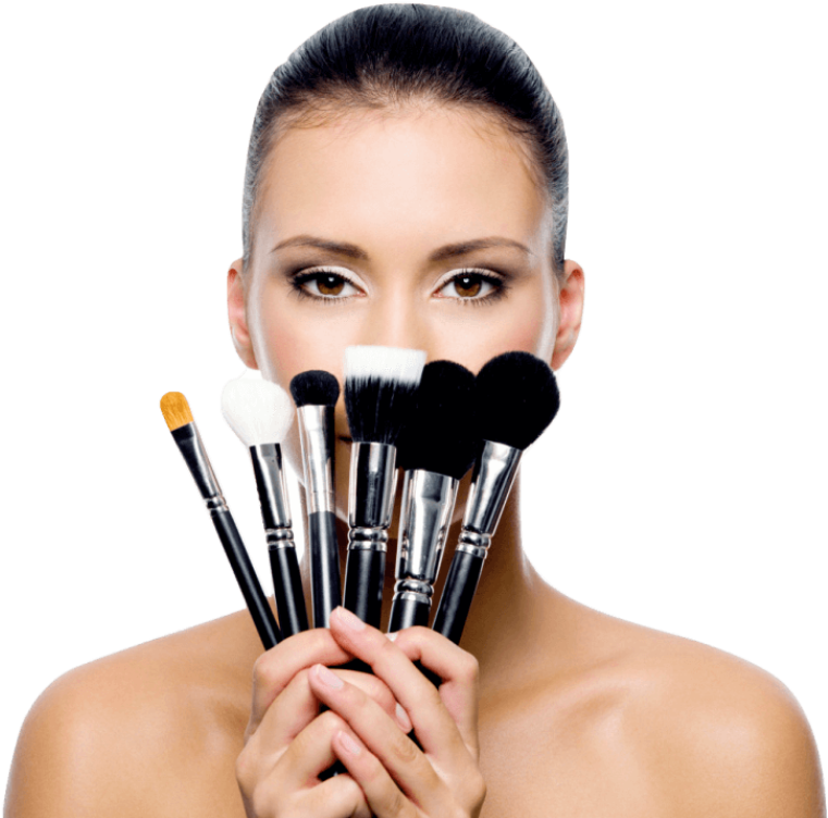 A Woman Holding A Set Of Makeup Brushes