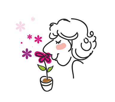A Woman Smelling A Flower
