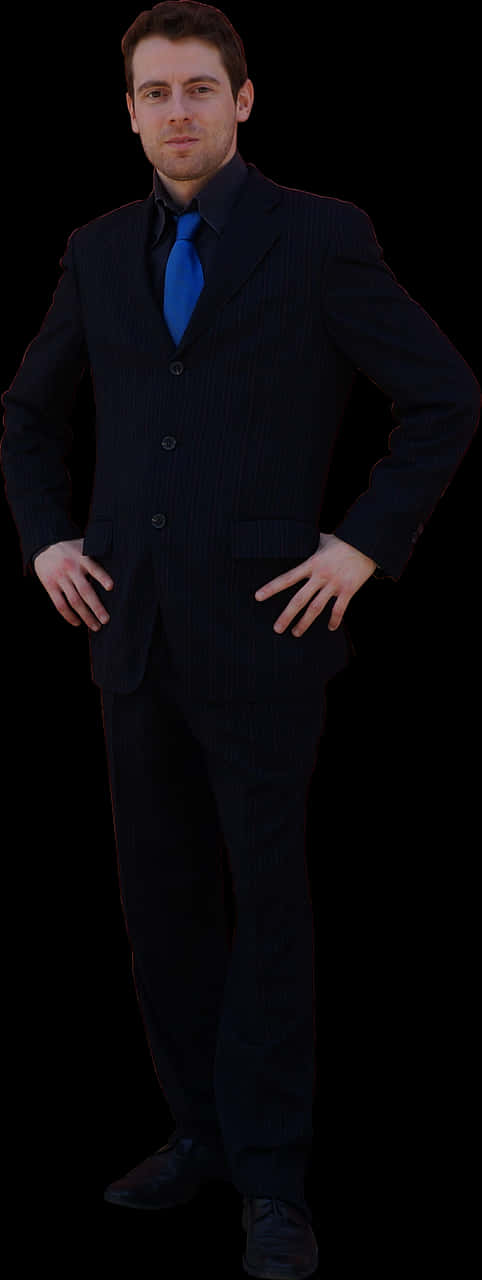 A Man In A Suit With His Hands On His Hips