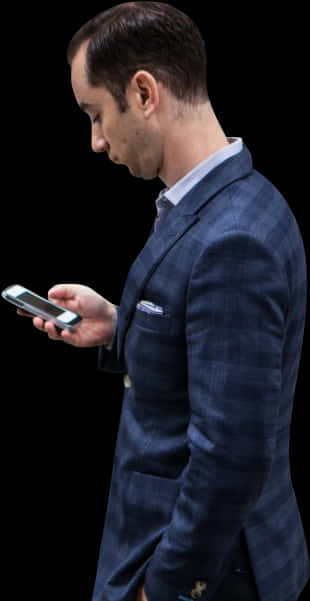 A Man In A Suit Looking At A Cell Phone