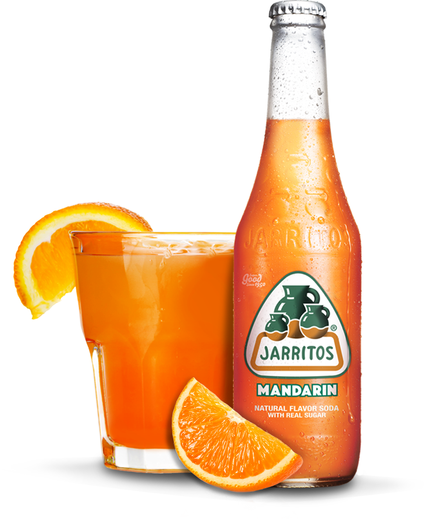 A Bottle Of Orange Soda Next To A Glass Of Orange Juice