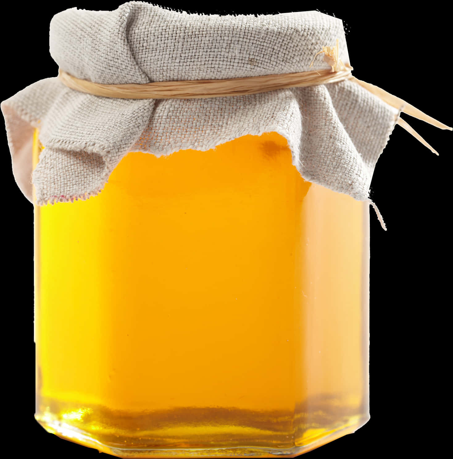 A Jar Of Honey With A Cloth Cover