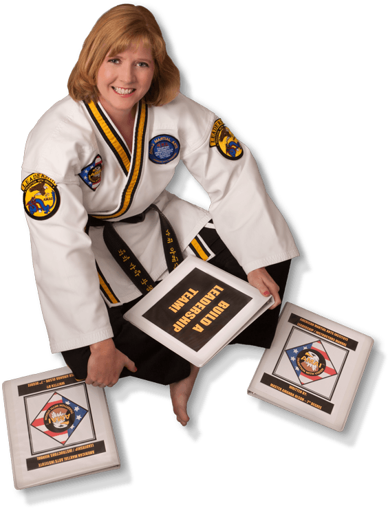 A Woman In Karate Uniform Holding Books