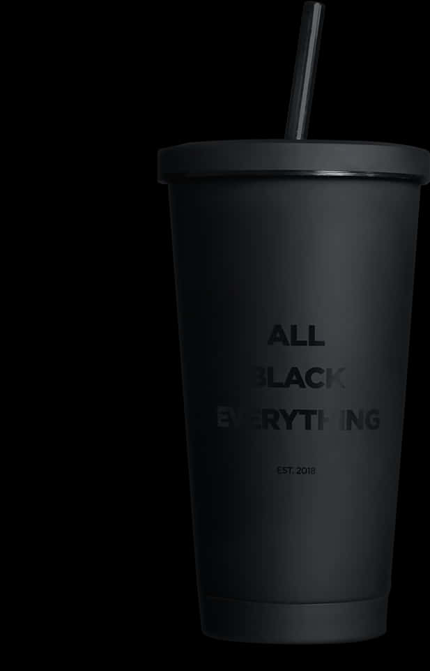 A Black Cup With A Straw