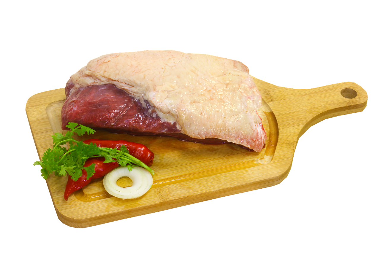 A Piece Of Meat On A Cutting Board