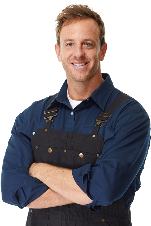 A Man Wearing A Blue Shirt And Black Overalls
