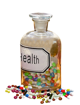 A Glass Bottle Filled With Pills