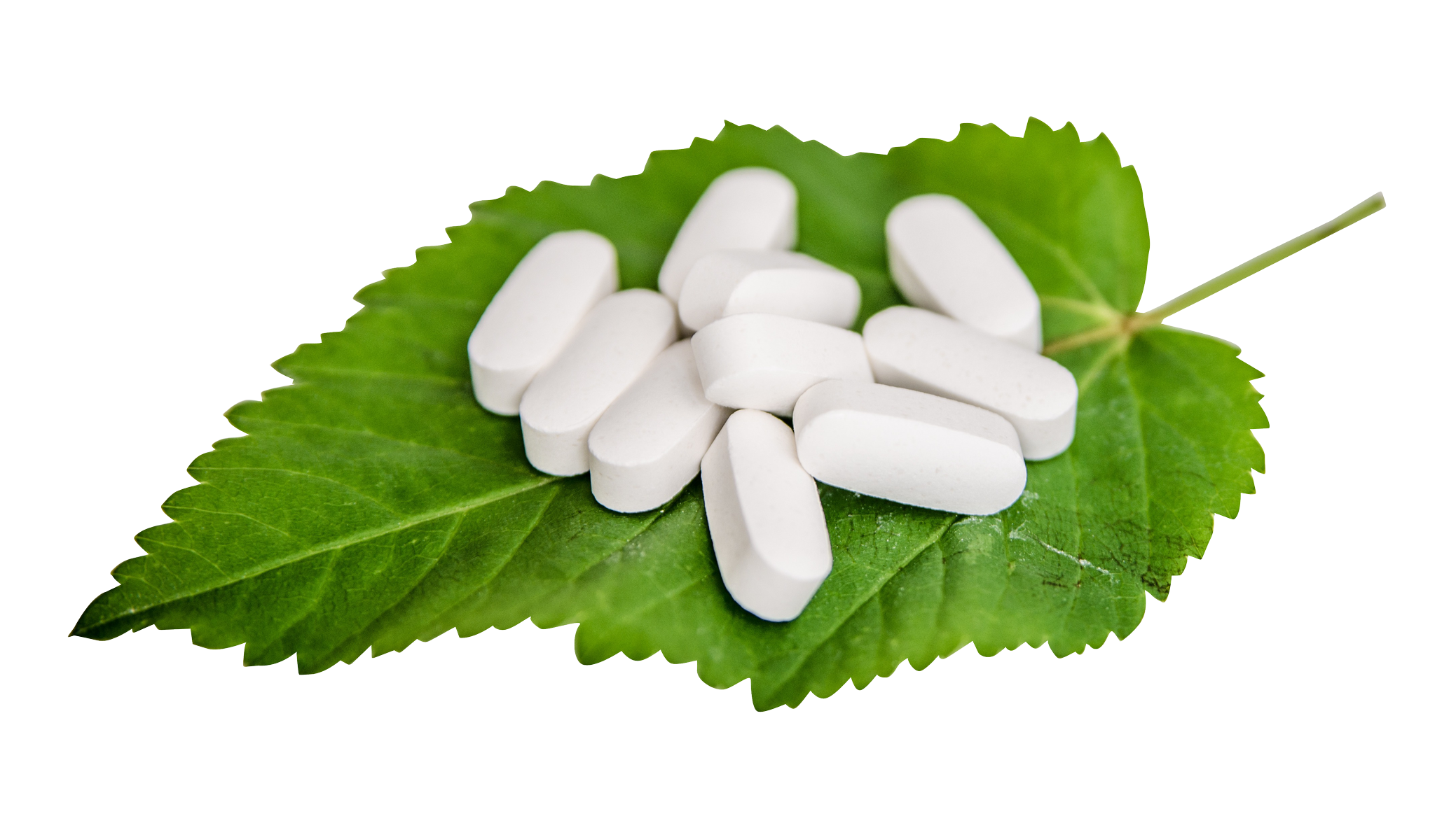 A Group Of Pills On A Leaf
