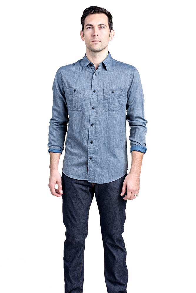 A Man Standing In A Blue Shirt