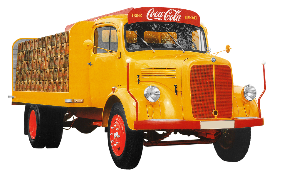 A Yellow And Red Truck With Crates Of Soda