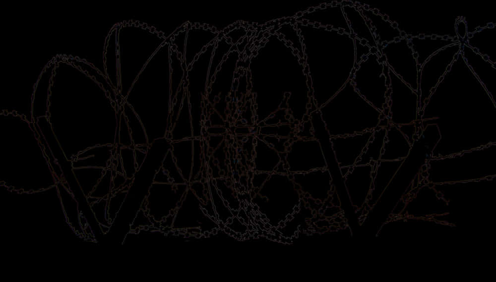 A Barbed Wire Fence On A Black Background
