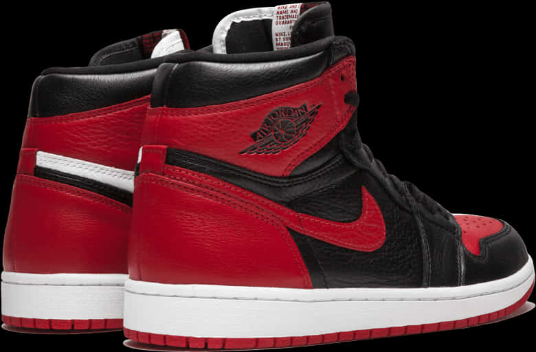 A Pair Of Red And Black Sneakers