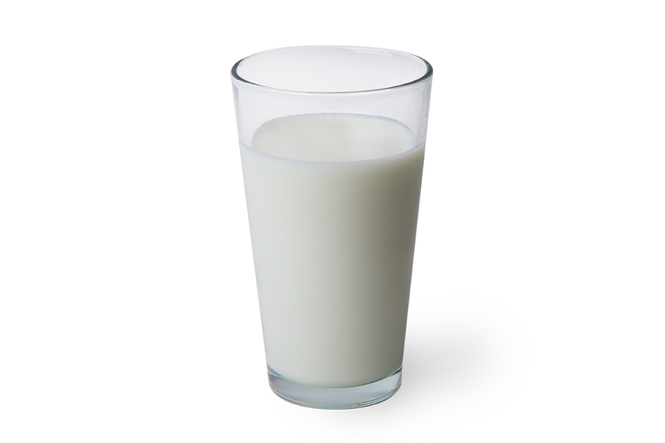 A Glass Of Milk On A Black Background