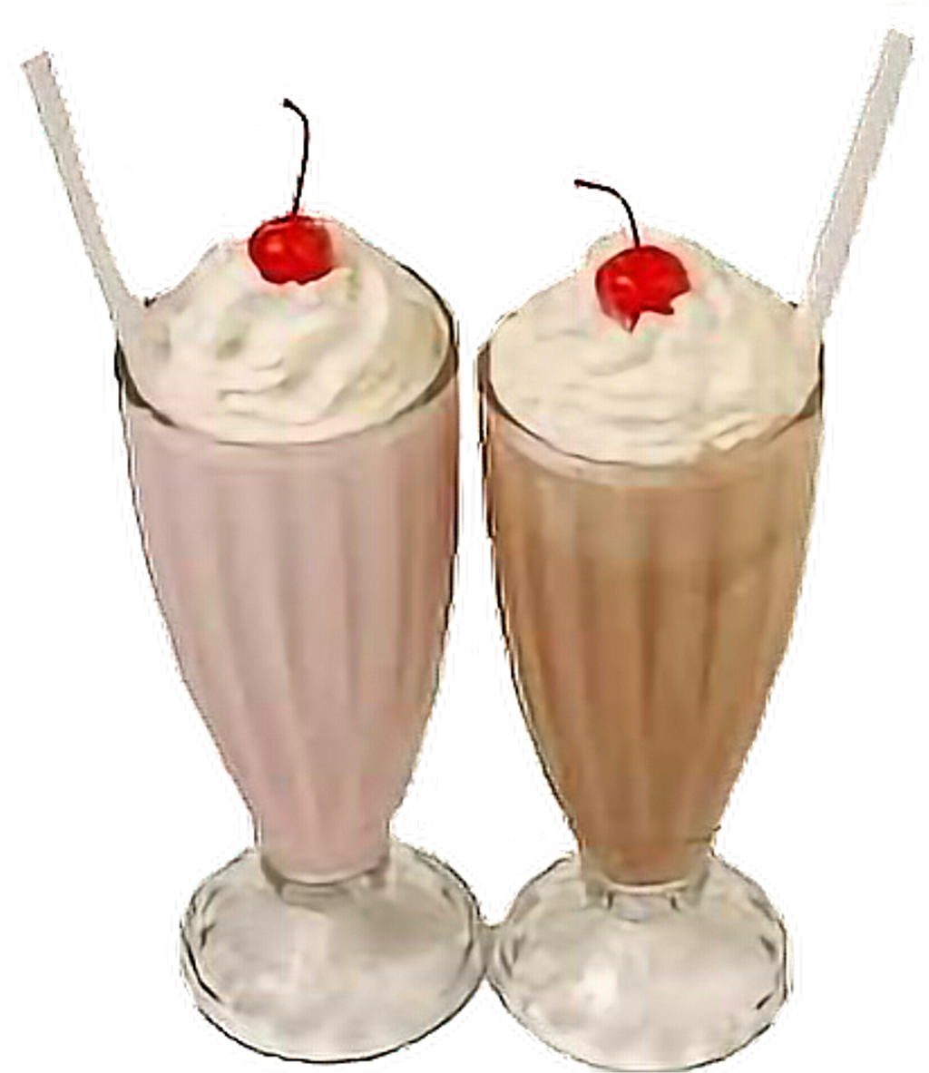 Two Glasses With Straws And A Cherry On Top