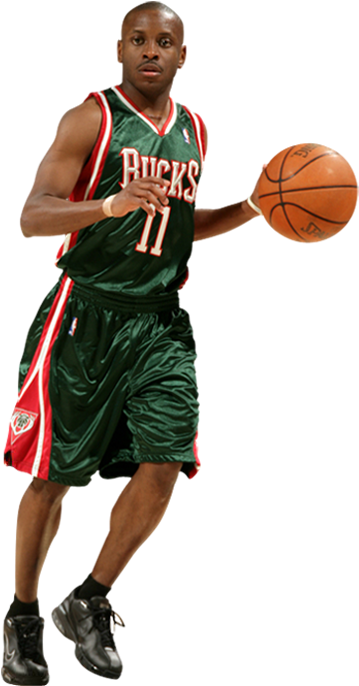 A Basketball Player In A Green Jersey With A Ball