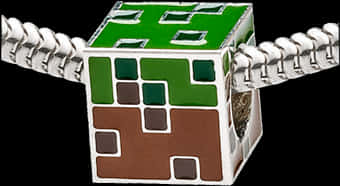 A Green And Brown Cube With Two Handles