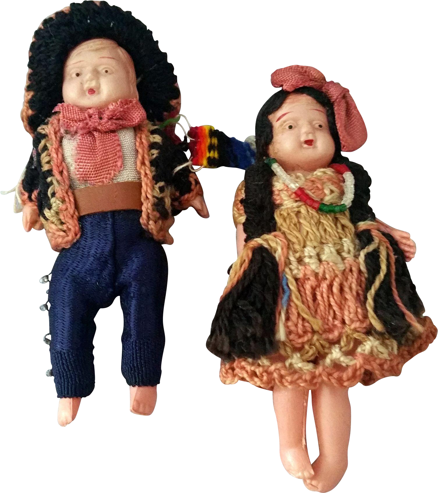 A Couple Of Dolls In Knitted Clothes