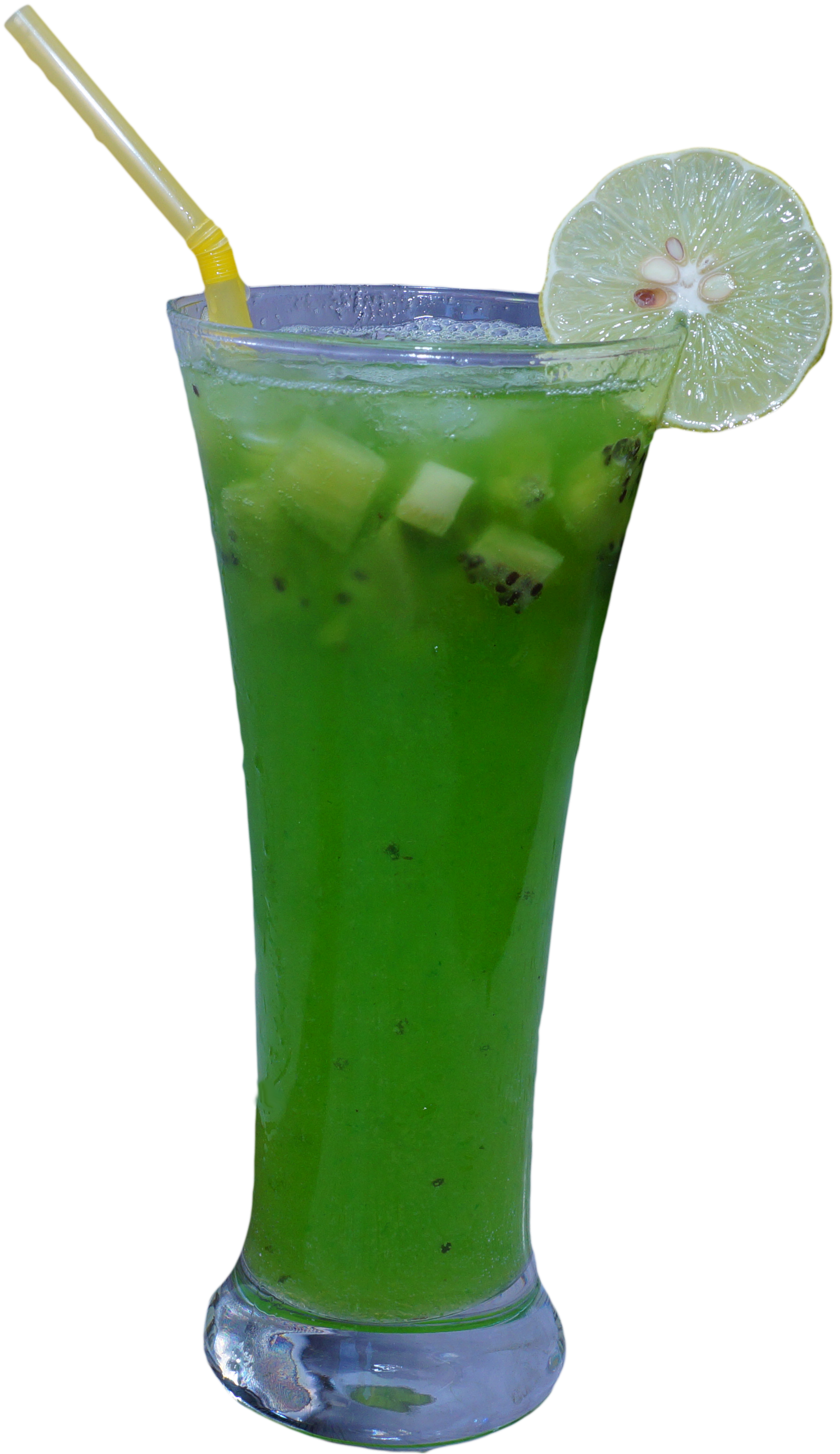 A Glass With A Green Drink And A Slice Of Lime