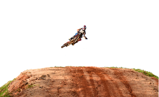 A Person On A Dirt Bike Jumping Over A Dirt Track