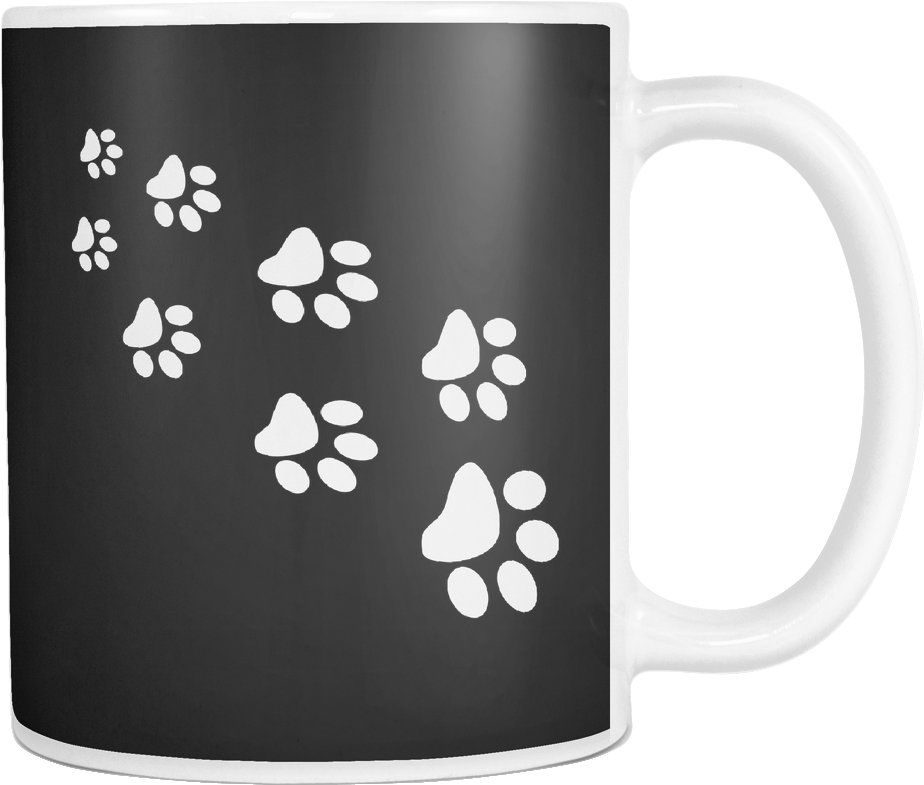 A Black And White Mug With Paw Prints